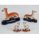 A large Staffordshire pen holder, 16cm in length, together with another smaller, 12cm,