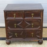 A Carolean revival chest of two short over two long drawers all with brass teardrop handles,