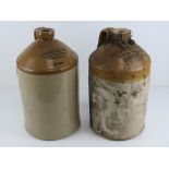 A pair of salt glazed stoneware two gallon jugs having printed marks upon for Duckworth & Co Ltd
