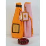 Two Veuve Cliquot bottle jackets for Brut and Rose.