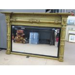 An Empire style gilded over-mantle mirror, frame measuring 126.5cm x 81cm.