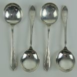 A set of four HM silver soup spoons,