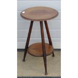 A circular tripod plater table, turned legs united by a circular undershelf, 40cm dia, 65cm high.