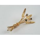 A yellow metal floral brooch, no apparent hallmark - one possibly Continental stamp near pin,