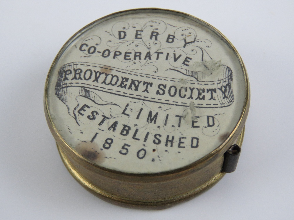 A Derby Cooperative Providence Society miniature brass 36" cloth retracting tape measure in brass - Image 2 of 4