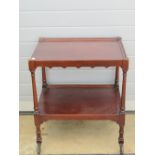 An Edwardian mahogany two tier tea trolley, 63 x 45cm, 72cm high, on wheels.