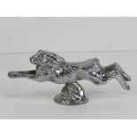 A silver plated car mascot bonnet ornament by Lejeune in the form of a running hare,