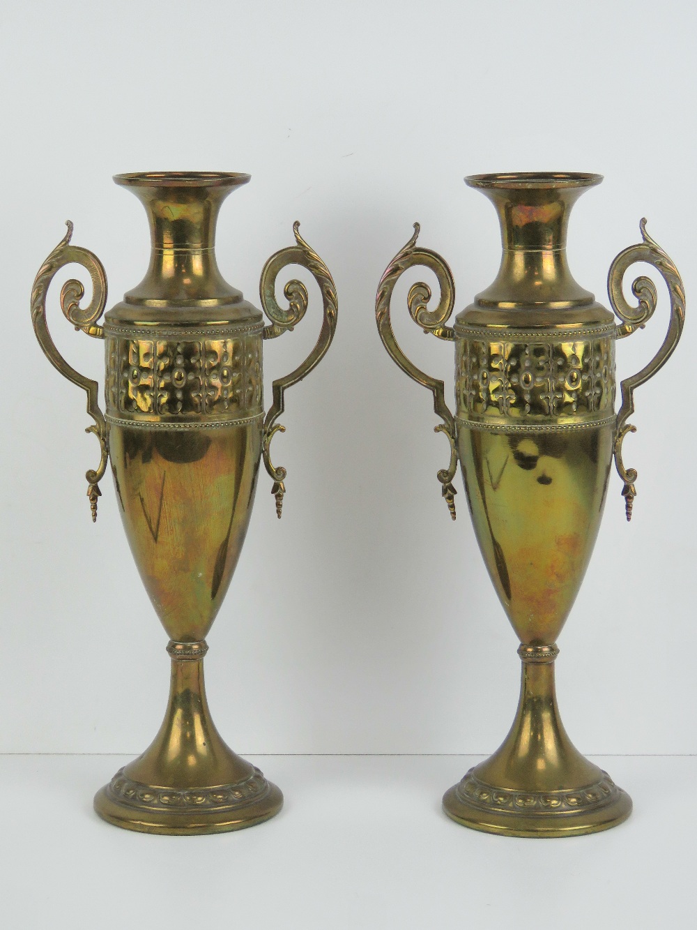 A pair of art nouveau tall brass urn style vases each marked C & K Co Tiel Holland 1378 to base.