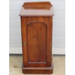 A single Victorian mahogany pot cupboard, door opening to reveal shelved compartment within,