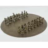 An unusual Oriental chess set having engraved brass board and metal pieces. Board 28.