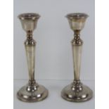 A pair of HM silver single candlesticks, each standing 22cm high and hallmarked for Birmingham 1965.