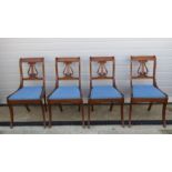 A set of four mahogany reproduction Georgian style Lyre backed dining chairs with drop in seats.