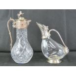 A good heavy cut glass and silver plated claret jug having Lion and shield finial, 31.5cm high.