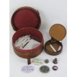 A circular pigskin leather collar box (a/f) containing a quantity of collar stiffeners,