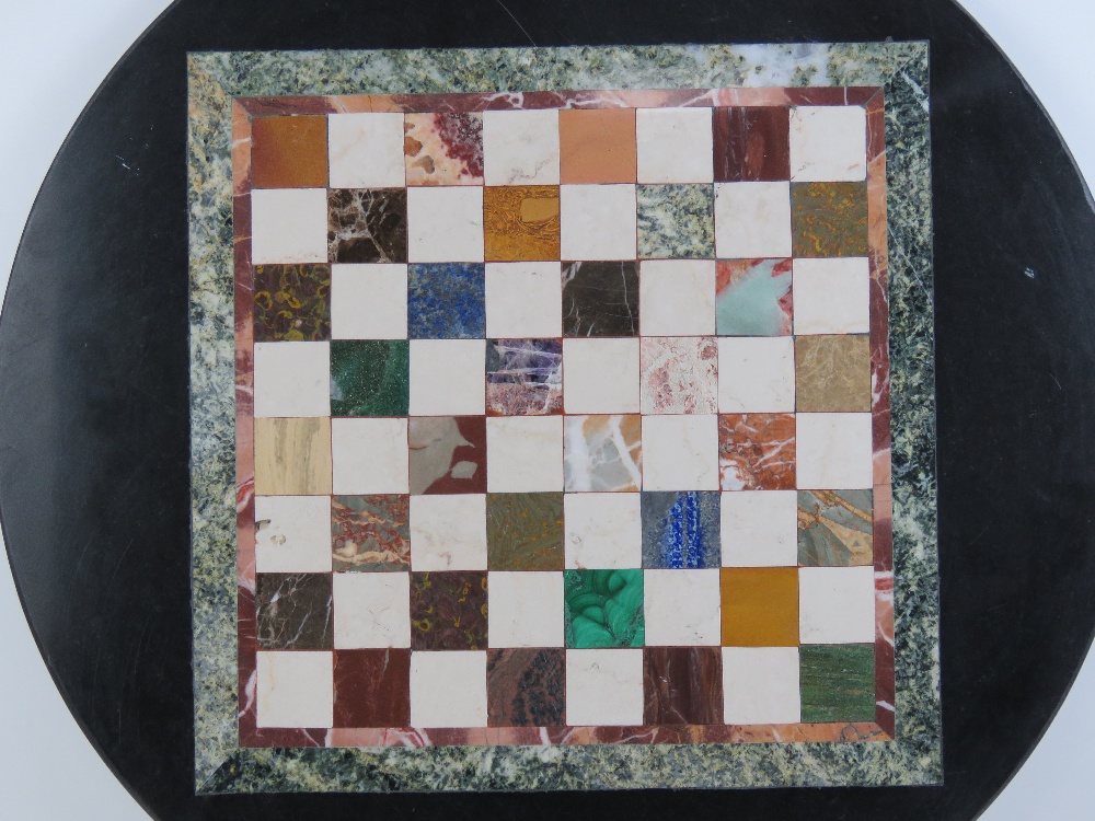 A circular Pietra Dura tabletop having inlaid marble and hardstone specimens in the form of a chess - Image 3 of 5