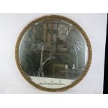 A decorative circular bevel edged wall mirror.