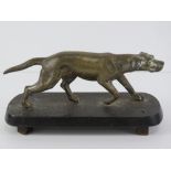 A well cast brass hunting dog mounted on cast iron base, 22cm in length.