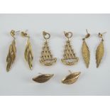 A pair of 9ct gold stud earrings in the form of leaves,