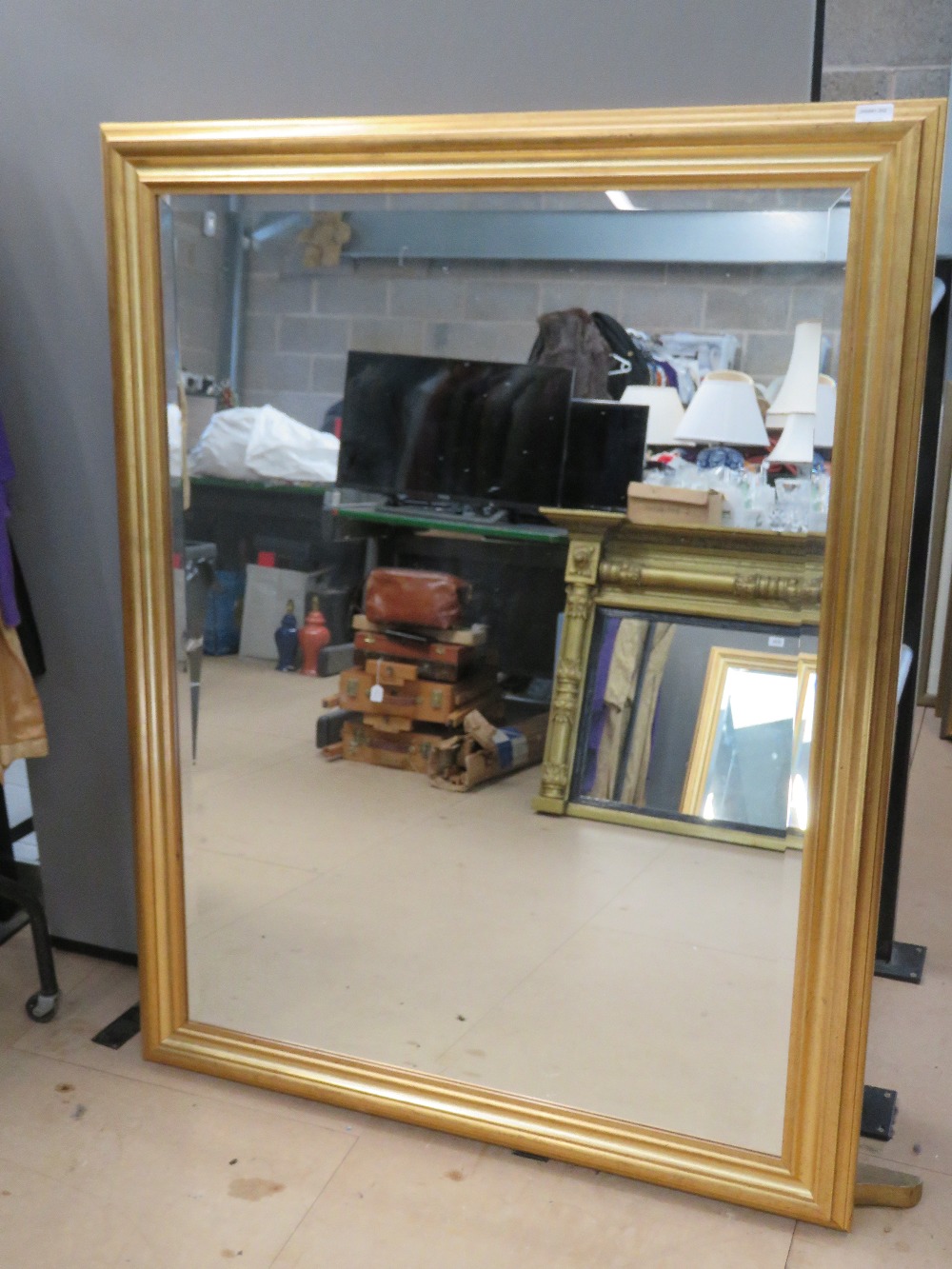 A good contemporary bevel edged wall mirror, 106 x 157cm.