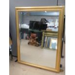 A good contemporary bevel edged wall mirror, 106 x 157cm.