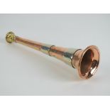 A copper and brass banded hunting horn, 23cm in length, with leather case.