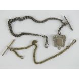 A HM silver graduated Albert chain with T-bar and clasp having albo silver fob upon,