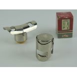 Two chrome Champagne bottle stoppers, one 'as new' in box.