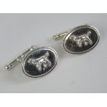 A pair of silver cufflinks having hunting dogs upon, stamped 925.
