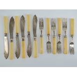 A set of six Victorian fish knives and forks each having silver blades or tines hallmarked for