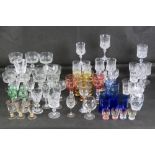 A quantity of assorted cut glass ware including a set of four green liqueur glasses,