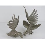 A pair of silver plated fighting cocks table decorations, each measuring approx 13cm in length.