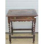 A Victorian Carolean revival frieze table with single drawer raised over barley twist supports,