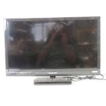 A 24" LCD Blaupunkt TV with integrated DVD player, with remote.