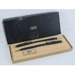 A Cross Classic Black ballpoint pen and pencil set in original box (box slightly a/f).