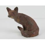 A fine cold painted bronze seated fox figurine by Michael Storey, signed to back of tail,