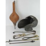 A copper coal scuttle with swing handle, together with a set of bellows, fire irons, tongs etc.