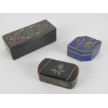 A papier mache lidded pin box with hand painted design to lid, 9cm in length,