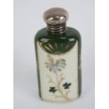 A porcelain hand painted and gilded perfume bottle having HM silver screw on lid,
