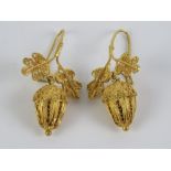 A pair of 18ct gold filigree earrings in the form of oak leaves with acorn suspended below,