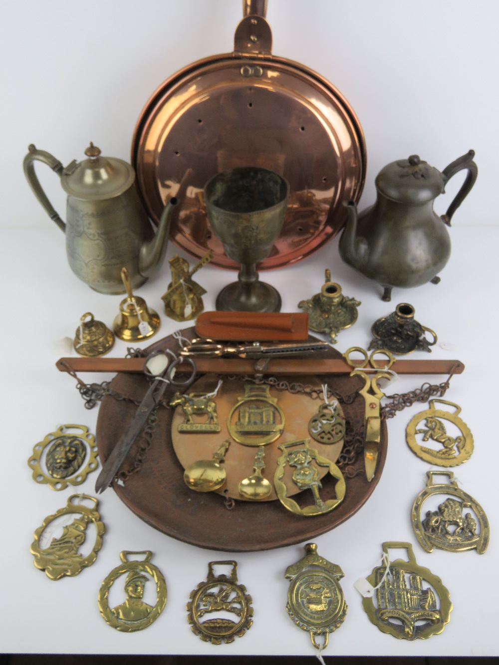A quantity of assorted brass and copperware inc bedpan, candlewick trimmers, hanging balance scales,
