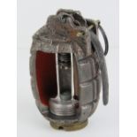 An inert Mills No5 grenade having cut-aw