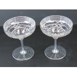 A pair of Art Deco silver overlaid glass