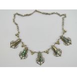 A silver and abalone shell necklace havi
