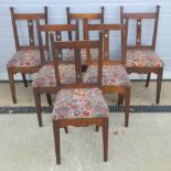 A set of six oak framed dining chairs of