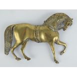 A large brass stable door plaque in the