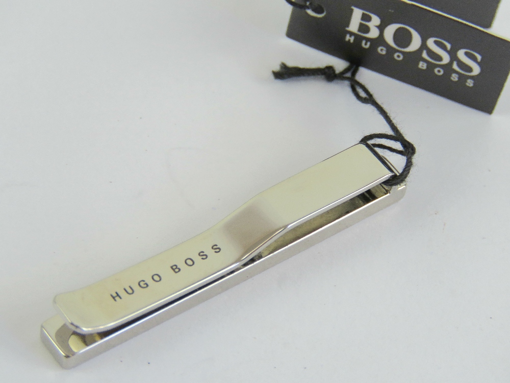 An as new Hugo Boss tie clip in box with