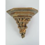 A gold painted cast resin decorative wal