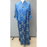 A floor length turquoise blue ladies embroidered jacket, having mandarin collar.