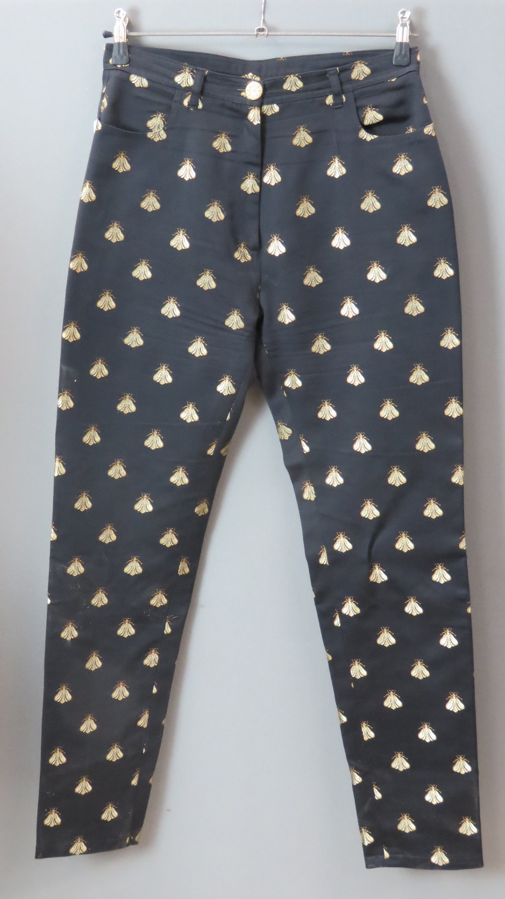 Paule Vasseur Paris; a pair of ladies trousers having embroidered Napoleonic bee on black ground,