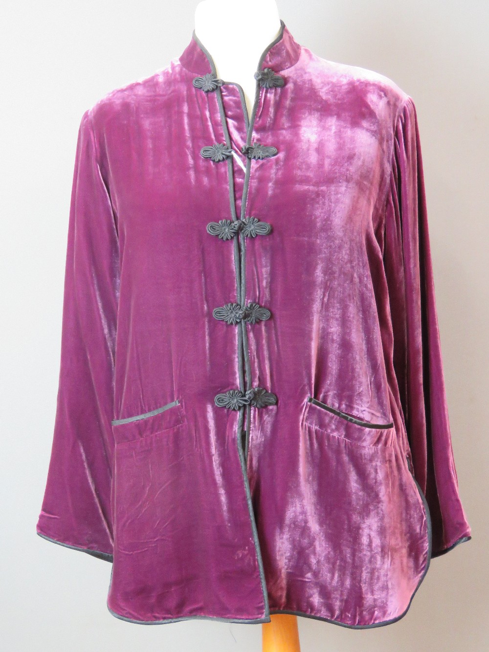 Ladies purple velvet jacket size L having mandarin collar with tie fastenings and two pockets.
